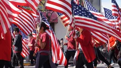 People holding US flags together outdoors