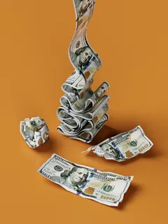 Stack of money on wooden table symbolizing wealth and finance