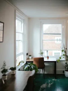 Living room with furniture near a large bright window