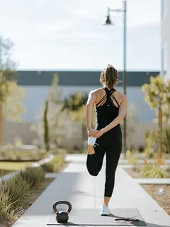 Woman exercising on yoga mat for women’s fitness workout